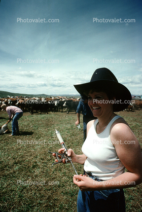 inoculating a calf, Cowgirl, Hat, Branding, Calf