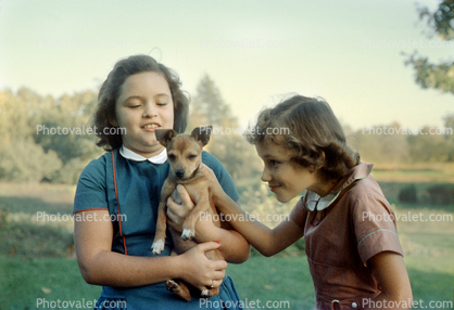 Two girls with a Puppy, 1950s