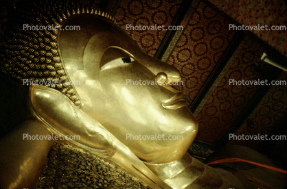 Golden Buddha Face Statue, side view
