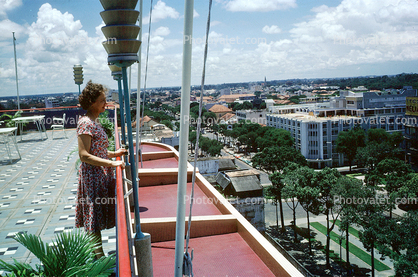 Woman overlooks the City, standing