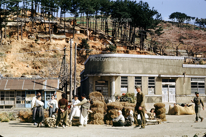 Building, hill, houses, women, men, Pusan, South Korea, April 1953, 1950s