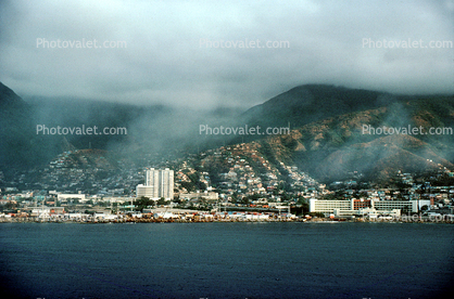 Docks, harbor, hillside, homes, waterfront, buildings, hills, mountains, city, La Guaira, Maiquetia, Venezuela