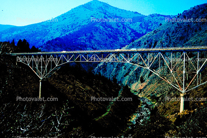 Upside down truss bridge, valley, hills, mountains