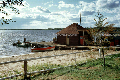 Dock, boats, Cabins, footpath, buildings, beach, sand, fence, God's Lake Lodge, Manitoba, Canada
