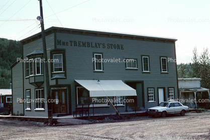 Tremblay's Store, awning, car, dirt road, building, Dawson City