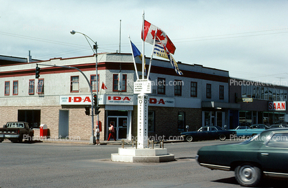 IDA, Alaska Highway, cars, buildings, Dawson City, 1960s