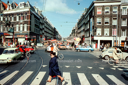 Cars, person, buildings, crosswalk, automobile, vehicles, 1960s, June 1977
