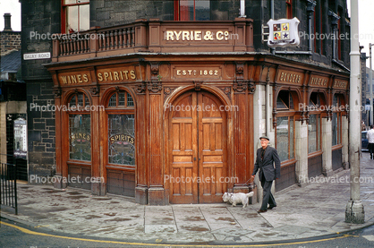 Ryrie's Bar, Ryrie & Co., Edinburgh, Man walking his dog, sidewalk, curb, doorway, windows, Scotland