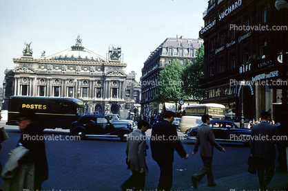 Postes, cars, buildings, people, 1940s