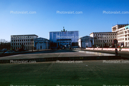 Brandenburg Gate in the center of Berlin, covered by a large tarp during renovation work.