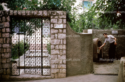 Man, Water Fountain, gate, brick, wall