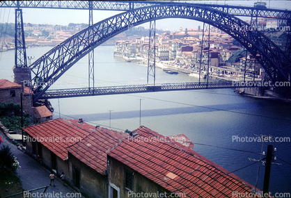 Douro River, Dom Luis I Bridge, double-decked metal arch bridge, red roofs, buildings, Porto