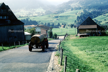 Water Truck, farm fields, buildings, barn, road, Switzerland