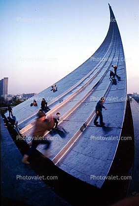 People Climbing the Space Obelisk, Sputnik Monument
