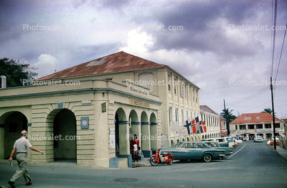 Western Union Building, Downtown Saint Croix, Cars, flags, Saint Croix, June 1965