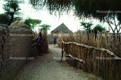 Village, walls, desert, woman drought, Diomga, Province de l? Oudalan, Sahel desert