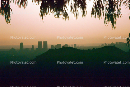 sunset, skyline, smog, haze, buildings, hill, people