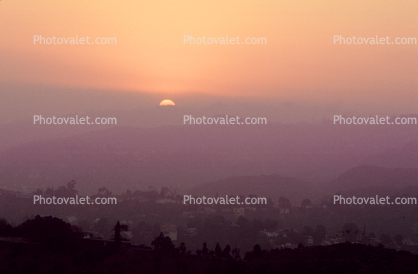 Sunset, layered hills, smog