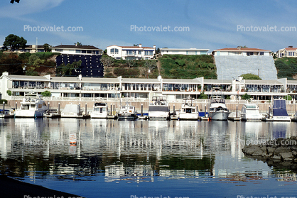 Marina, boats, water reflection, homes, houses, buildings
