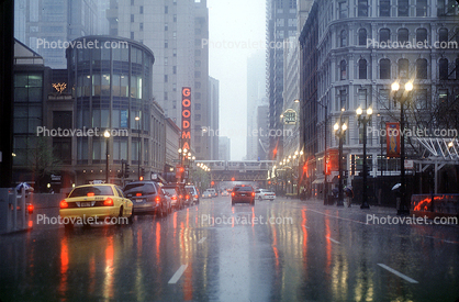 Goodman Theater, downpour, Cars, automobile, vehicles, rain, inclement weather, slick, taxi cabs, buildings, street, Chicago