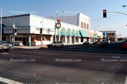 Topper, Buildings, stores, cars, street, awning, traffic light, Shops, Christmas decorations, intersection, road, Modesto, December 1988, 1980s
