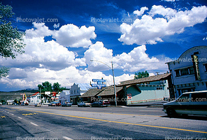 Clouds, cumulus, buildings, shops, Highway 395, cars