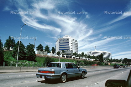 amazing clouds, buildings, highway, cars