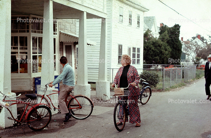 Tourists Bicycling, Woman, buildings, July 1974, 1970s