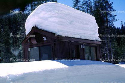 Snow Shed Garage with a Heap of Snow on the Roof