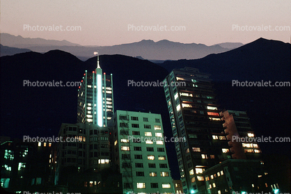 double exposure of buildings and mountains