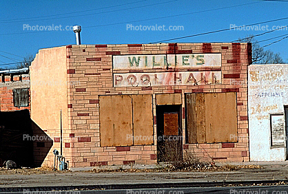 Willie's Pool Hall no more, boarded up building, brick