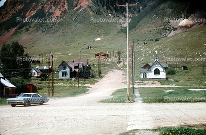 church, dirt road, car, dust, homes, houses, vehicles, Automobile, July 1969, 1960s