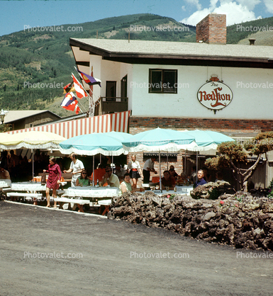Red-Lion Inn, building, parasol, flags, July 1970