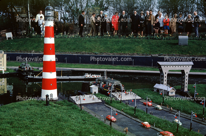 Lighthouse, cars, ferry landing, boat, Miniature park, Madurodam, Scheveningen district of The Hague, Netherlands, April 1968, 1960s