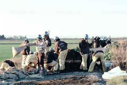 Sand Bags, Rescue Workers filling sandbags, levee, Northern California