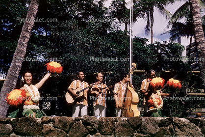Guitar, Bass Fiddle, pom poms, lei, woman, men, lava rocks, October 1960, 1960s