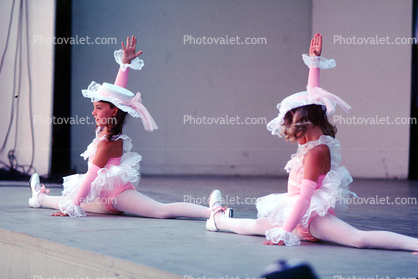 Cute Girls on stage, dancing, hats, microphone