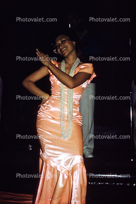 Woman dancing, dress, necklace, ethnic costume, July 1963, 1960s
