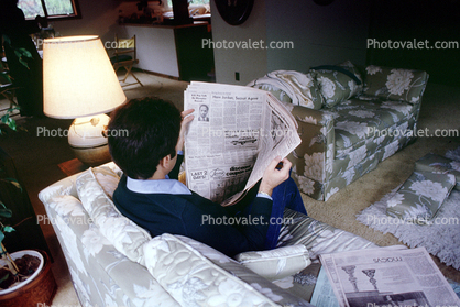 Man reads the morning newspaper