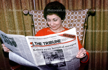 Woman Reading the Oakland Tribune Newpaper
