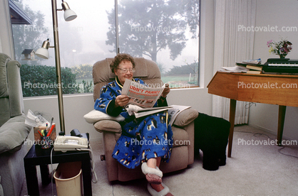 Woman reading the morning newspaper