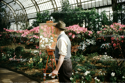 Man Painting Flowers in an Arboretum