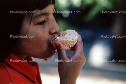 Girl Eating an Orange
