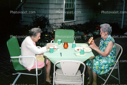 Backyard, lunch, women, Hot dogs, chairs, 1960s