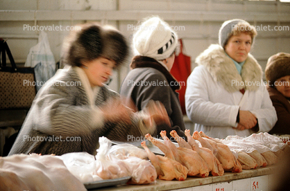 Chicken, women shoppers, coats, hats