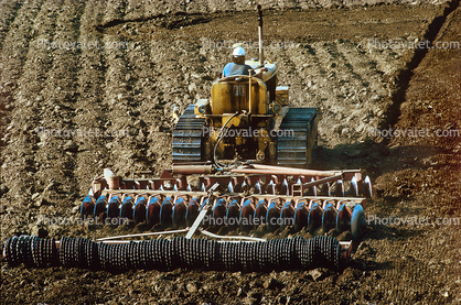 Harrow Disc Plow, Plowing, Tilling, Tractor, Rototill, Rotary-Till, Farmer, near Sacramento, California, USA, Dirt, soil