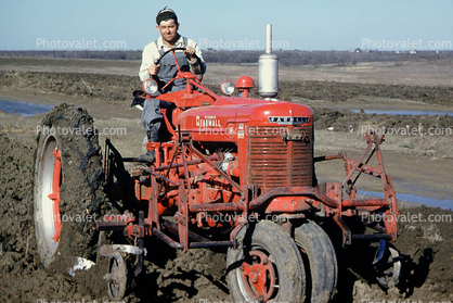 Farmall Tractor, Plowing, Tilling, Farmer, mud, soil, dirt, wheeled, 1950s