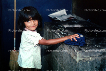 Girl boiling a Chicken, Chicken Slaughterhouse, San Salvador, El Salvador