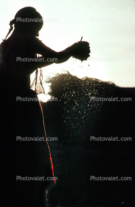 Woman processing wheat, Gujarat, India