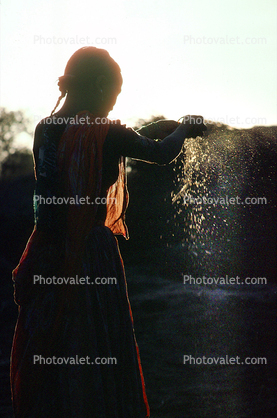 Woman processing wheat, Gujarat, India